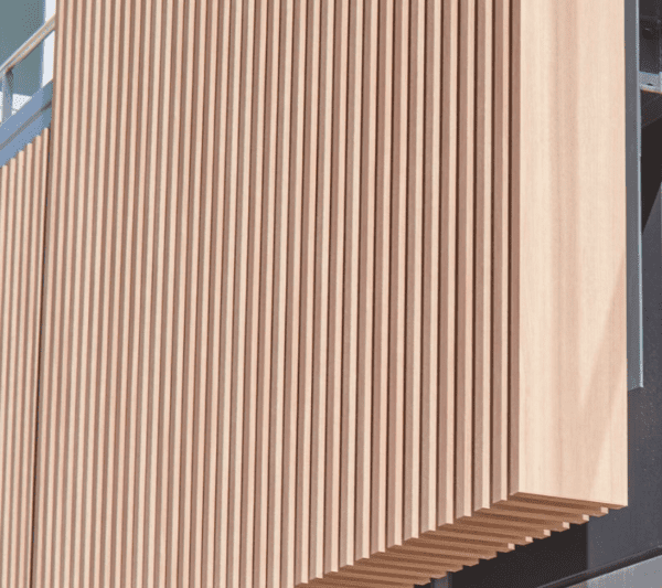 Closeup photo of architectural finish FW-1122EX Lionesse Walnut installed on a building exterior